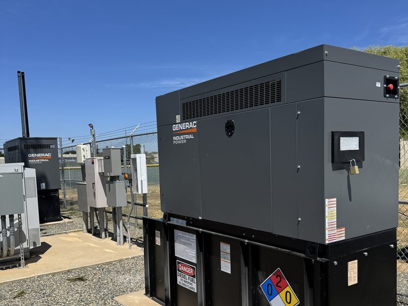 Generac diesel generator on concrete pad with switchgear and transfer equipment